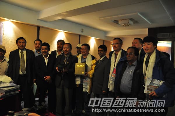 Gochali hosts and an international delegation gathered for a presentation