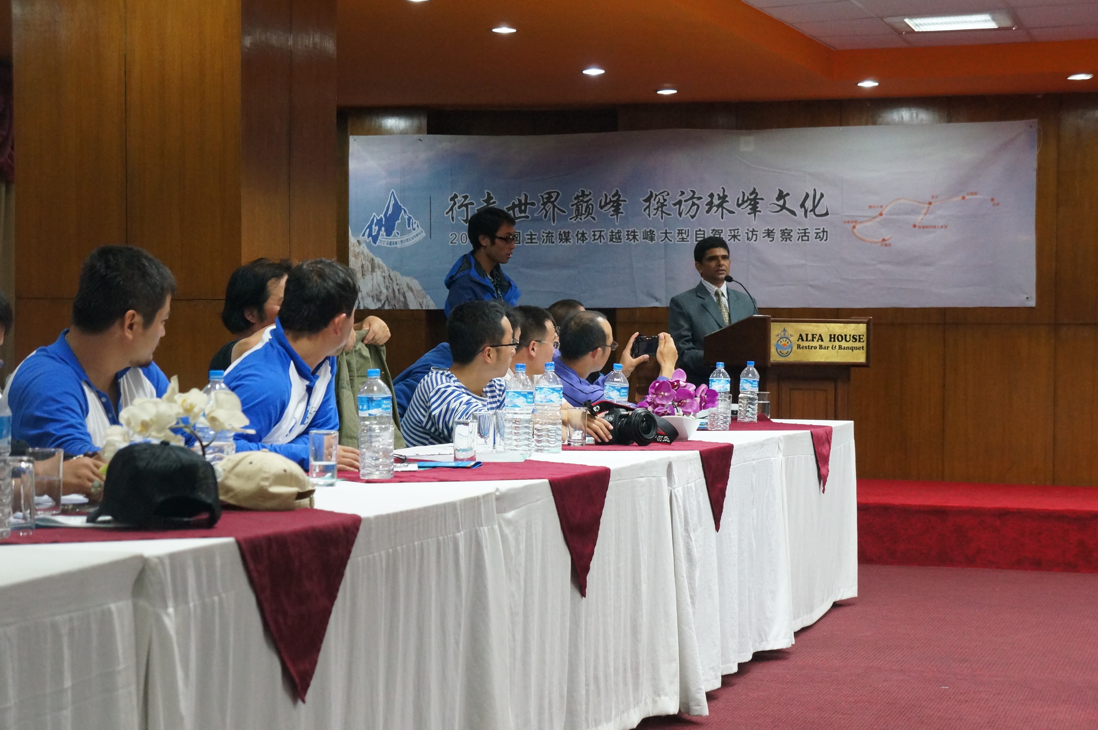 A Gochali representative speaking to an international media delegation