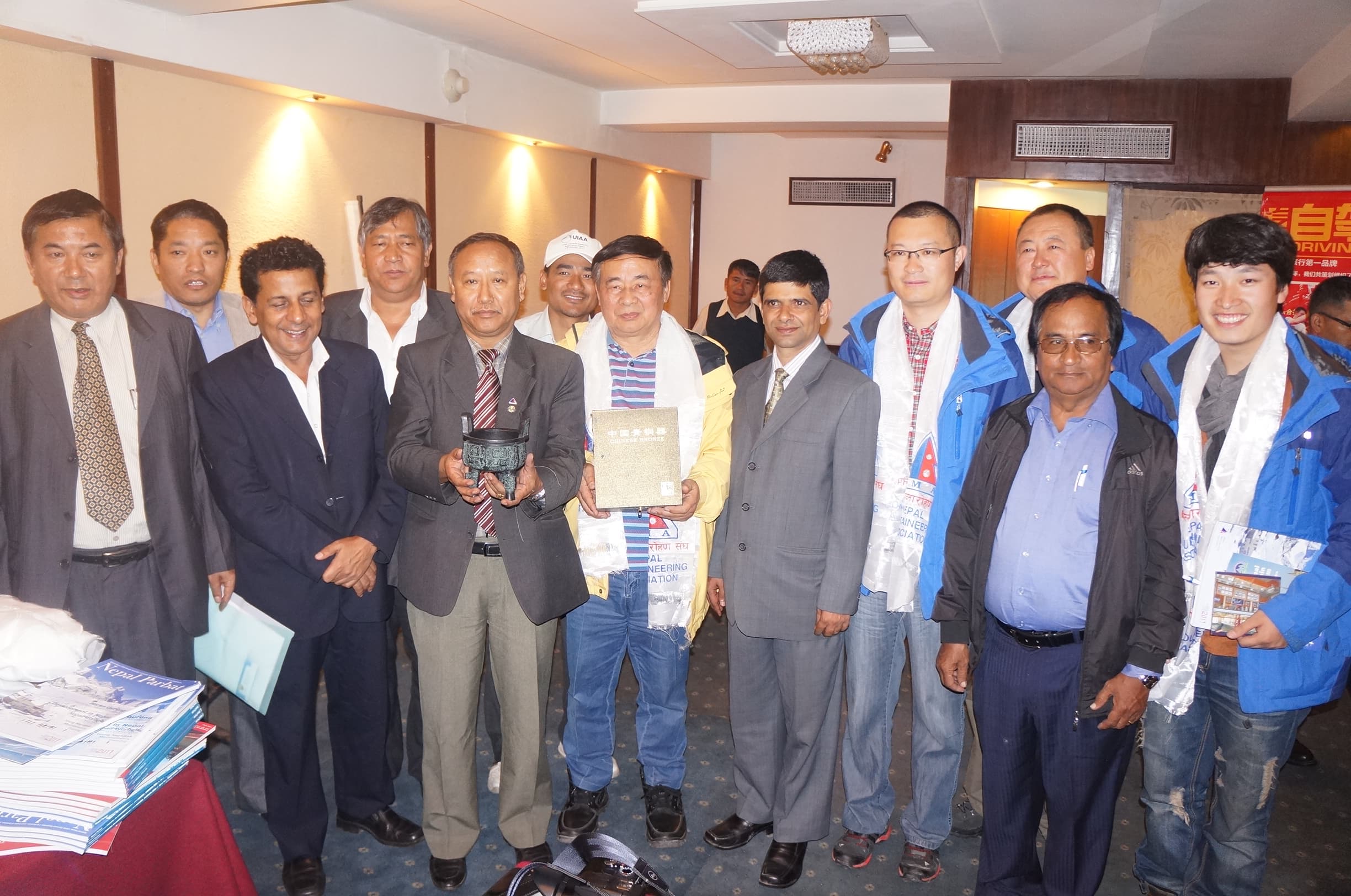Gochali team and visiting media delegates posing together after a formal exchange